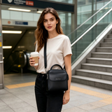 Woman using a commuter crossbody bag during everyday errands.